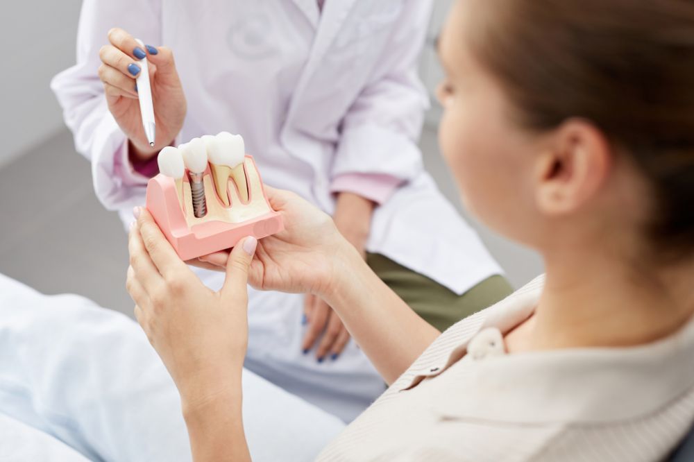 a woman is getting dental treatment.