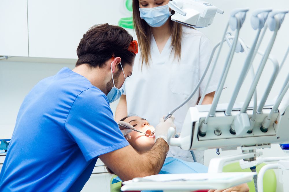 a woman i getting dental treatment